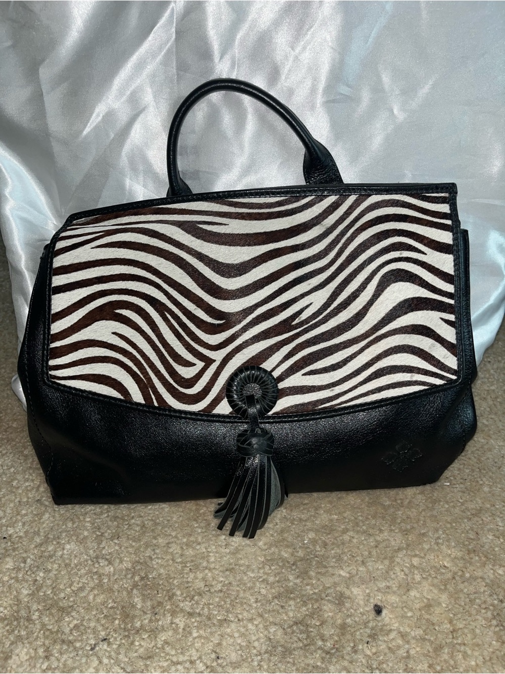 Black Leather Handbag with Zebra Print Flap